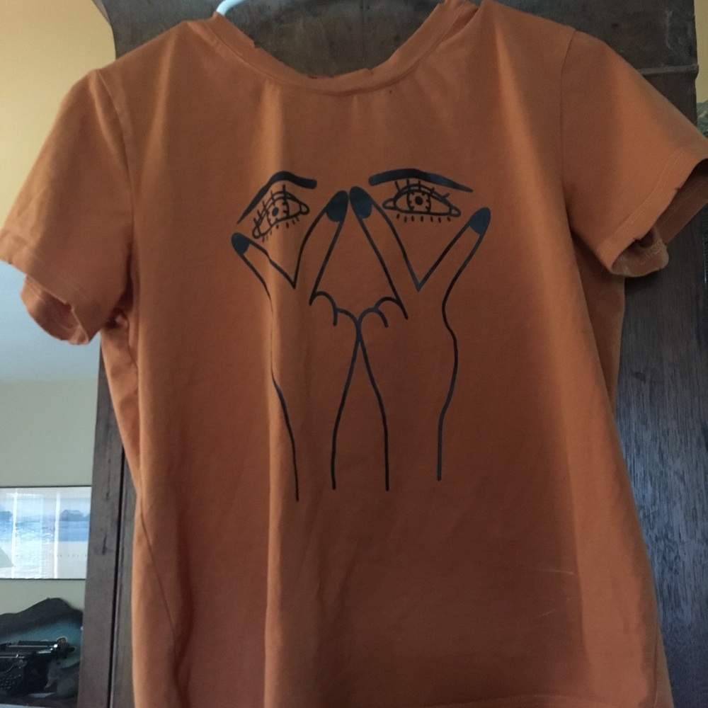 Orange tee with distressed collar